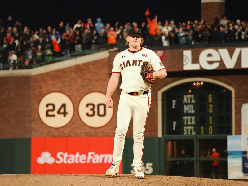 Jul 31, 2024; San Francisco, California, USA; San Francisco Giants starting pitcher Logan Webb (62) on the mound after pitching a complete game against the Oakland Athletics at Oracle Park. Mandatory Credit: Kelley L Cox-USA TODAY Sports