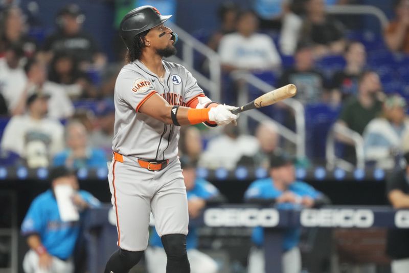 Jun 1, 2025; Miami, Florida, USA;  San Francisco Giants center fielder Luis Matos (29) watches his three-run home run in the fourth inning against the Miami Marlins at loanDepot Park. Mandatory Credit: Jim Rassol-Imagn Images