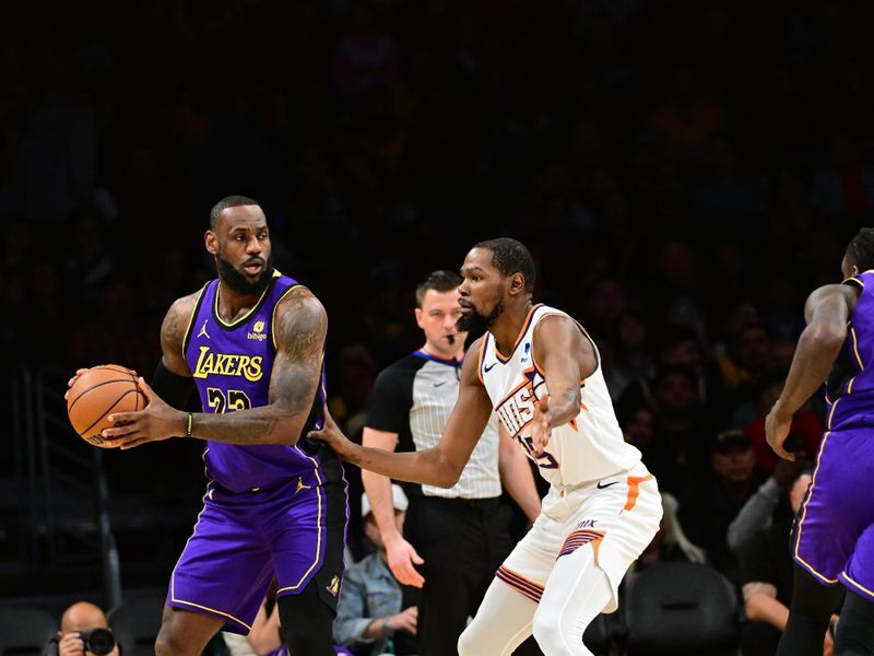 LOS ANGELES, CA - JANUARY 11: Kevin Durant #35 of the Phoenix Suns plays defense against LeBron James #23 of the Los Angeles Lakers during the game on January 11, 2024 at Crypto.Com Arena in Los Angeles, California. NOTE TO USER: User expressly acknowledges and agrees that, by downloading and/or using this Photograph, user is consenting to the terms and conditions of the Getty Images License Agreement. Mandatory Copyright Notice: Copyright 2024 NBAE (Photo by Adam Pantozzi/NBAE via Getty Images)