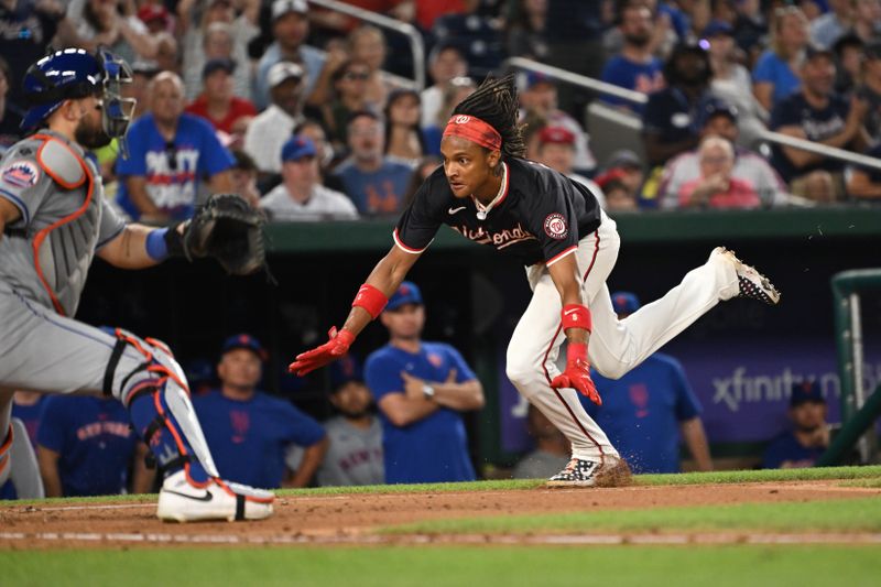 Jul 3, 2024; Washington, District of Columbia, USA; Washington Nationals shortstop CJ Abrams (5) slides head first in home plate to score a run against the New York Mets during the seventh inning at Nationals Park. Mandatory Credit: Rafael Suanes-USA TODAY Sports