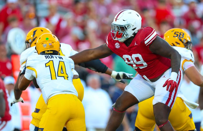 Oct 4, 2025; Norman, Oklahoma, USA;  Oklahoma Sooners defensive lineman Markus Strong (99) rushes Kent State Golden Flashes quarterback Deante Ruffin (14) during the second half at Gaylord Family-Oklahoma Memorial Stadium. Mandatory Credit: Kevin Jairaj-Imagn Images