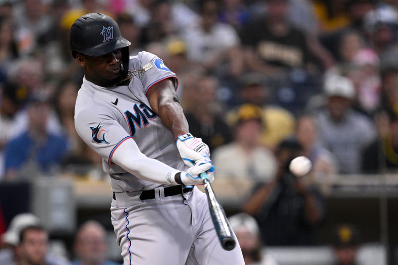 Aug 22, 2023; San Diego, California, USA; Miami Marlins designated hitter Jorge Soler (12) hits a home run against the San Diego Padres during the third inning at Petco Park. Mandatory Credit: Orlando Ramirez-USA TODAY Sports