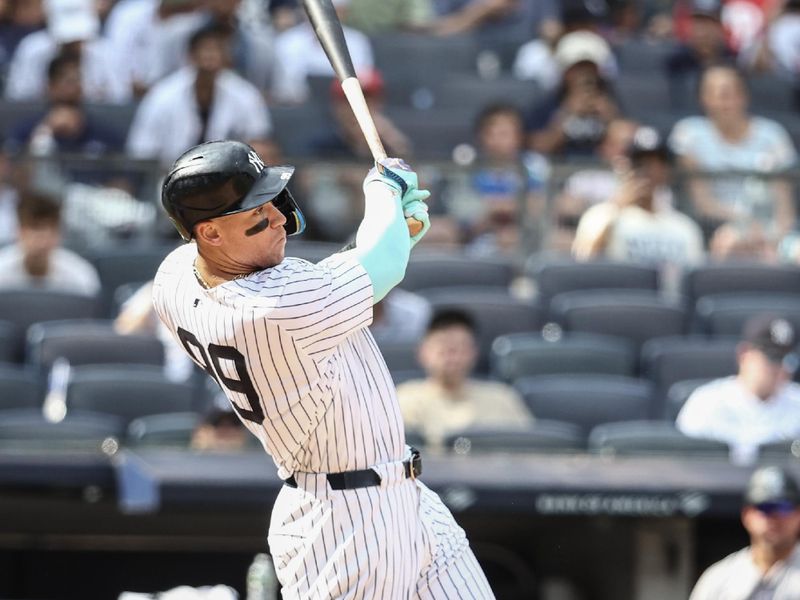 Aug 25, 2024; Bronx, New York, USA;  New York Yankees center fielder Aaron Judge (99) hits a solo home run in the seventh inning against the Colorado Rockies at Yankee Stadium. Mandatory Credit: Wendell Cruz-USA TODAY Sports