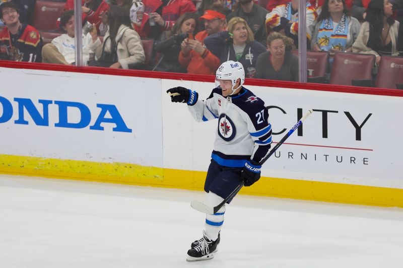 Nov 24, 2023; Sunrise, Florida, USA; Winnipeg Jets left wing Nikolaj Ehlers (27) celebrates after scoring against the Florida Panthers during the third period at Amerant Bank Arena. Mandatory Credit: Sam Navarro-USA TODAY Sports