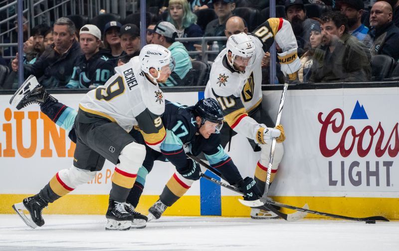 Nov 8, 2024; Seattle, Washington, USA;  Seattle Kraken forward Jaden Schwartz (17) battles Vegas Golden Knights forward Jack Eichel (9) and forward Nicolas Roy (10) for the puck during the second period at Climate Pledge Arena. Mandatory Credit: Stephen Brashear-Imagn Images