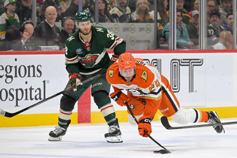 Nov 15, 2025; Saint Paul, Minnesota, USA;  Minnesota Wild forward Ryan Hartman (38) is called for tripping on the play with Anaheim Ducks forward Jansen Harkins (24) during the third period at Grand Casino Arena. Mandatory Credit: Nick Wosika-Imagn Images