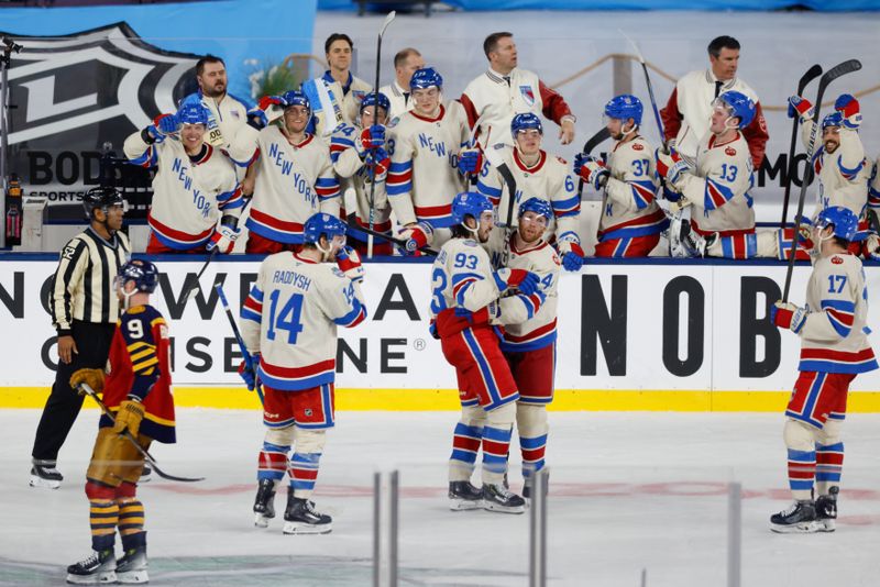 Jan 2, 2026; Miami, Florida, USA; New York Rangers center Mika Zibanejad (93) celebrates with teammates after scoring an empty net goal for his third of the game against the Florida Panthers during the third period in the 2026 Winter Classic ice hockey game at loanDepot Park. Mandatory Credit: Rhona Wise-Imagn Images