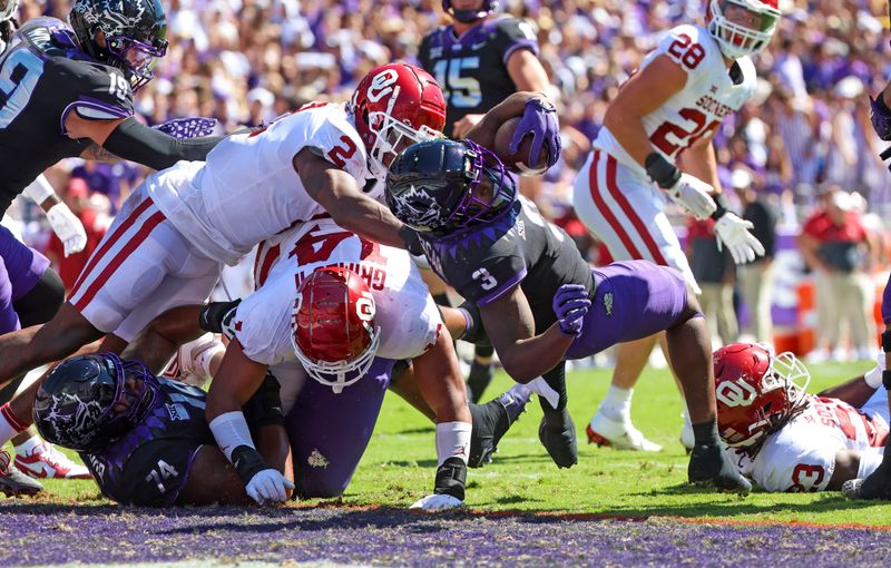 Oct 1, 2022; Fort Worth, Texas, USA;  TCU Horned Frogs running back Emari Demercado (3) dives for a touchdown past Oklahoma Sooners linebacker David Ugwoegbu (2) during the first half at Amon G. Carter Stadium. Mandatory Credit: Kevin Jairaj-USA TODAY Sports