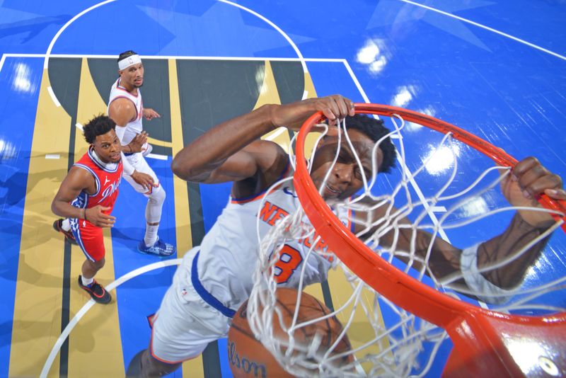 PHILADELPHIA, PA - NOVEMBER 12: OG Anunoby #8 of the New York Knicks dunks the ball during the game against the Philadelphia 76ers during the Emirates NBA Cup game on November 12, 2024 at the Wells Fargo Center in Philadelphia, Pennsylvania NOTE TO USER: User expressly acknowledges and agrees that, by downloading and/or using this Photograph, user is consenting to the terms and conditions of the Getty Images License Agreement. Mandatory Copyright Notice: Copyright 2024 NBAE (Photo by Jesse D. Garrabrant/NBAE via Getty Images)