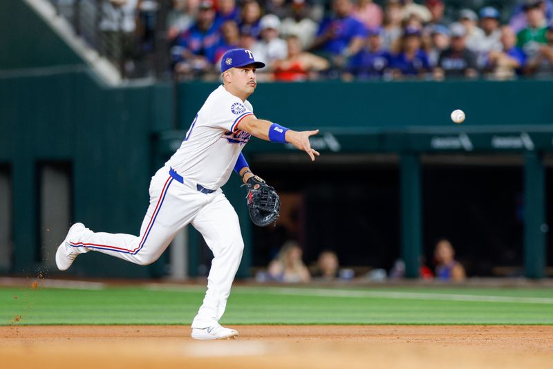 May 15, 2024; Arlington, Texas, USA; Texas Rangers first base Nathaniel Lowe (30) tosses the ball during the second inning against the Cleveland Guardians at Globe Life Field. Mandatory Credit: Andrew Dieb-USA TODAY Sports