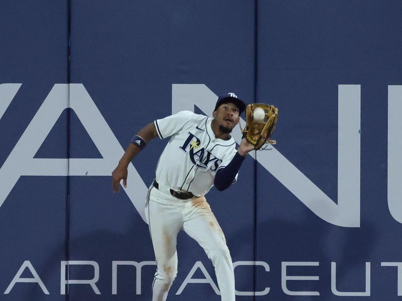 Sep 16, 2025; St. Petersburg, Florida, USA; Tampa Bay Rays left fielder Chandler Simpson (14) catches a fly ball during the ninth inning against the Toronto Blue Jays at George M. Steinbrenner Field. Mandatory Credit: Kim Klement Neitzel-Imagn Images