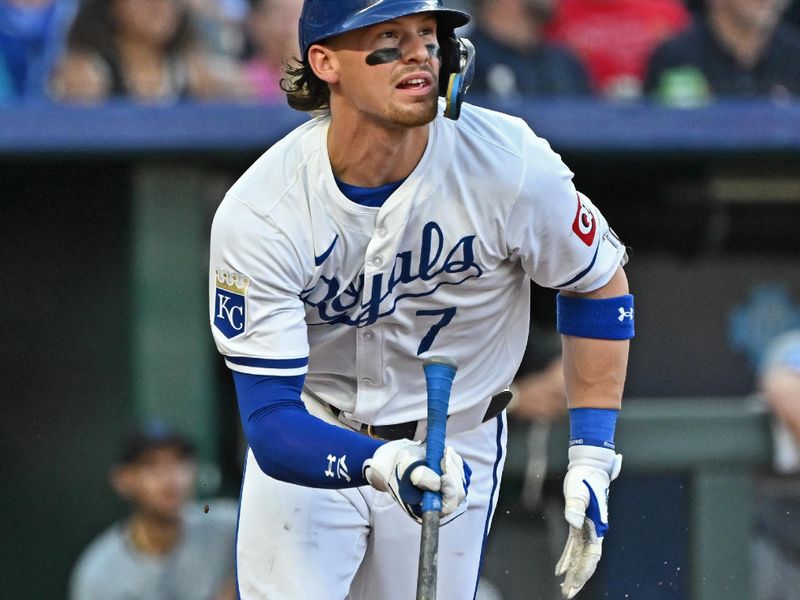 Jun 25, 2024; Kansas City, Missouri, USA; Kansas City Royals shortstop Bobby Witt Jr. (7) hits a double in the third inning against the Miami Marlins at Kauffman Stadium. Mandatory Credit: Peter Aiken-USA TODAY Sports