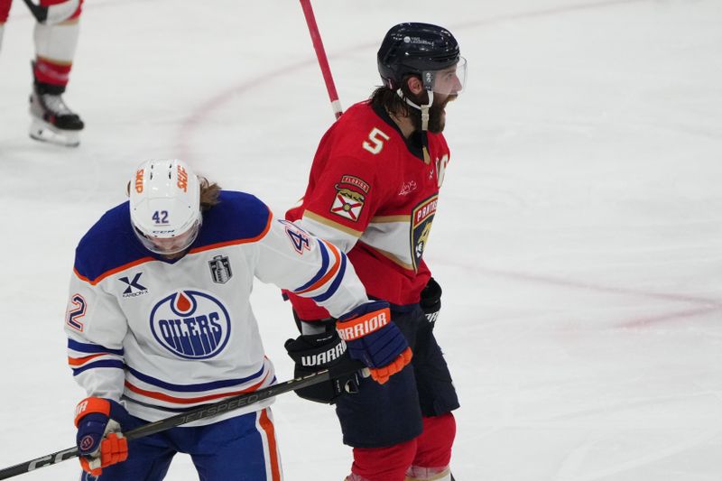 Jun 9, 2025; Sunrise, Florida, USA; Florida Panthers defenseman Aaron Ekblad (5) celebrates scoring during the third period against Edmonton Oilers in game three of the 2025 Stanley Cup Final at Amerant Bank Arena. Mandatory Credit: Jim Rassol-Imagn Images