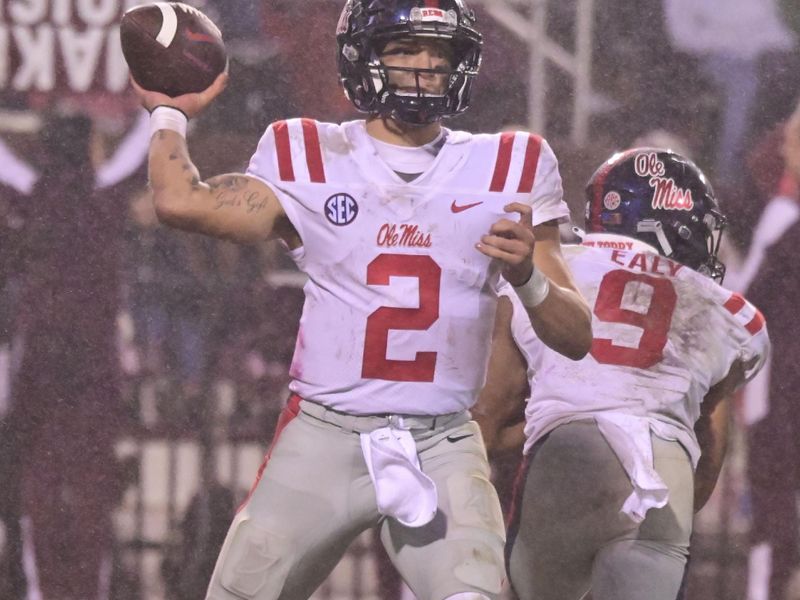 Nov 25, 2021; Starkville, Mississippi, USA; Mississippi Rebels quarterback Matt Corral (2) makes a pass against the Mississippi State Bulldogs during the third quarter at Davis Wade Stadium at Scott Field. Mandatory Credit: Matt Bush-USA TODAY Sports