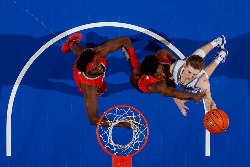 Feb 10, 2023; Colorado Springs, Colorado, USA; Air Force Falcons guard Jake Heidbreder (3) drives to the net against New Mexico Lobos guard Jamal Mashburn Jr. (5) and forward Morris Udeze (24) in the second half at Clune Arena. Mandatory Credit: Isaiah J. Downing-USA TODAY Sports