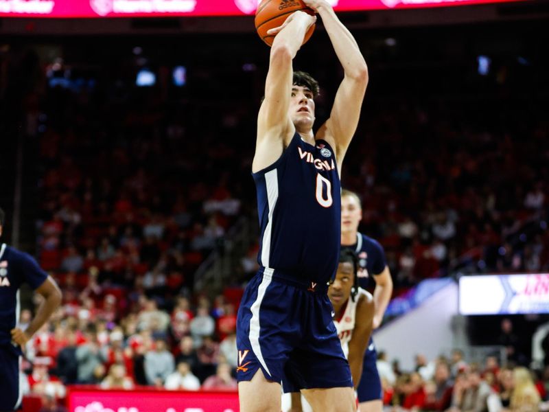 Jan 6, 2024; Raleigh, North Carolina, USA; Virginia Cavaliers forward Blake Buchanan (0) shoots a free throw during the second half against North Carolina State Wolfpack at PNC Arena. Mandatory Credit: Jaylynn Nash-USA TODAY Sports