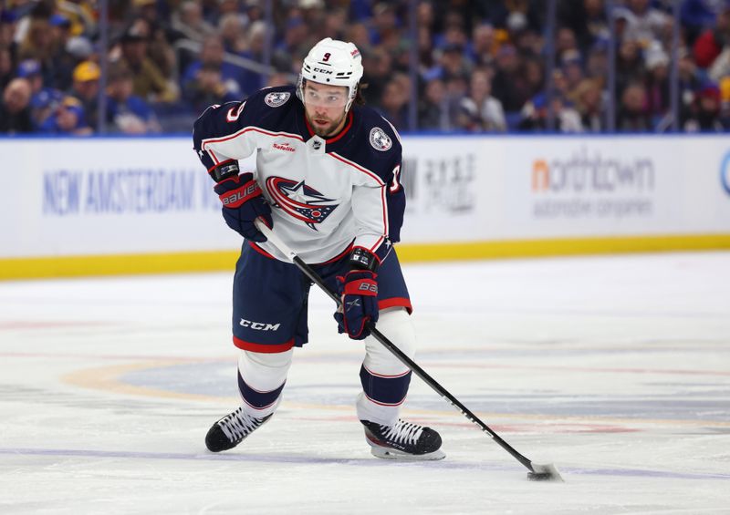 Dec 30, 2023; Buffalo, New York, USA;  Columbus Blue Jackets defenseman Ivan Provorov (9) looks to make a pass during the first period against the Buffalo Sabres at KeyBank Center. Mandatory Credit: Timothy T. Ludwig-USA TODAY Sports