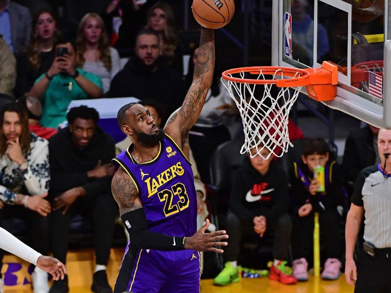 LOS ANGELES, CA - JANUARY 5: LeBron James #23 of the Los Angeles Lakers dunks the ball during the game against the Memphis Grizzlies on January 5, 2024 at Crypto.Com Arena in Los Angeles, California. NOTE TO USER: User expressly acknowledges and agrees that, by downloading and/or using this Photograph, user is consenting to the terms and conditions of the Getty Images License Agreement. Mandatory Copyright Notice: Copyright 2024 NBAE (Photo by Adam Pantozzi/NBAE via Getty Images)