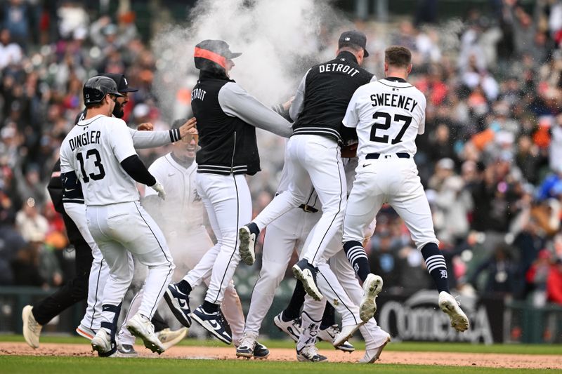 Apr 6, 2025; Detroit, Michigan, USA;  Detroit Tigers first baseman Spencer Torkelson (20) gets swarmed by his teammates after hitting a game-winning two-run walk off double against the Chicago White Sox in the ninth inning at Comerica Park. Mandatory Credit: Lon Horwedel-Imagn Images