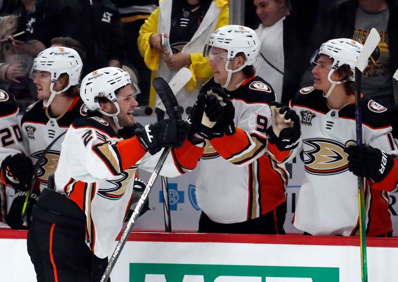 Oct 30, 2023; Pittsburgh, Pennsylvania, USA;  Anaheim Ducks center Mason McTavish (left) reacts with the Anaheim bench after scoring a game winning short-handed goal against the Pittsburgh Penguins during the third period at PPG Paints Arena. Anaheim won 4-3. Mandatory Credit: Charles LeClaire-USA TODAY Sports