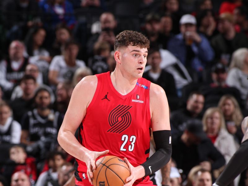 PORTLAND, OR - DECEMBER 13: Donovan Clingan #23 of the Portland Trail Blazers handles the ball during the game against the San Antonio Spurs on December 13, 2024 at the Moda Center Arena in Portland, Oregon. NOTE TO USER: User expressly acknowledges and agrees that, by downloading and or using this photograph, user is consenting to the terms and conditions of the Getty Images License Agreement. Mandatory Copyright Notice: Copyright 2024 NBAE (Photo by Cameron Browne/NBAE via Getty Images)