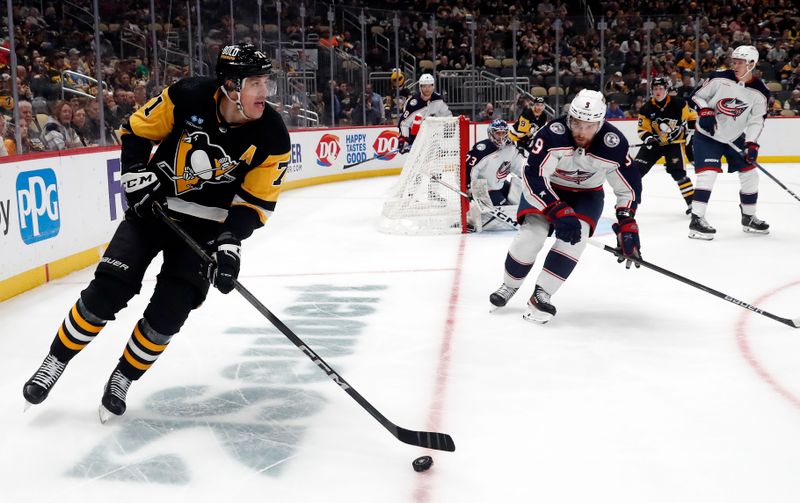 Mar 5, 2024; Pittsburgh, Pennsylvania, USA; Pittsburgh Penguins center Evgeni Malkin (71) moves the puck against the Columbus Blue Jackets during the third period at PPG Paints Arena. The Penguins won 5-3. Mandatory Credit: Charles LeClaire-USA TODAY Sports