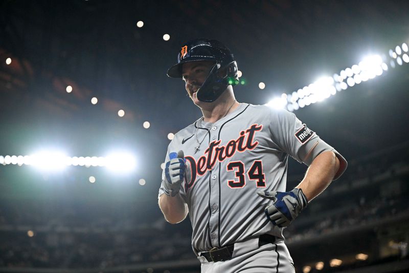 Jun 3, 2024; Arlington, Texas, USA; Detroit Tigers catcher Jake Rogers (34) comes off the field after he hits the game winning home run against the Texas Rangers during the eighth inning at Globe Life Field. Mandatory Credit: Jerome Miron-USA TODAY Sports