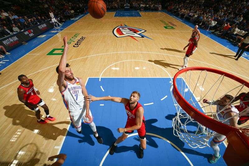 OKLAHOMA CITY, OK - OCTOBER 9: Chet Holmgren #7 of the Oklahoma City Thunder passes the ball during the game against the Houston Rockets during a NBA pre season game on October 9, 2024 at Paycom Center in Oklahoma City, Oklahoma. NOTE TO USER: User expressly acknowledges and agrees that, by downloading and or using this photograph, User is consenting to the terms and conditions of the Getty Images License Agreement. Mandatory Copyright Notice: Copyright 2024 NBAE (Photo by Zach Beeker/NBAE via Getty Images)