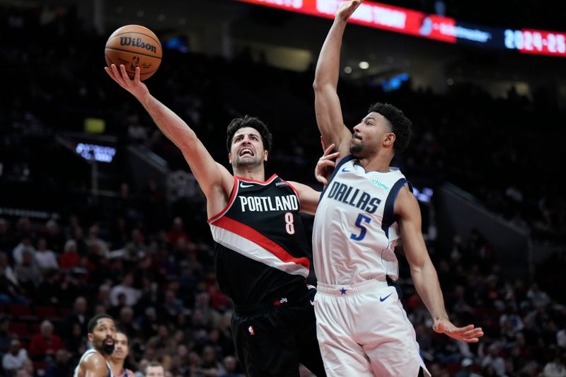 PORTLAND, OREGON - DECEMBER 01: Deni Avdija #8 of the Portland Trail Blazers drives to the basket under pressure from Quentin Grimes #5 of the Dallas Mavericks during the second half at Moda Center on December 01, 2024 in Portland, Oregon. NOTE TO USER: User expressly acknowledges and agrees that, by downloading and or using this photograph, User is consenting to the terms and conditions of the Getty Images License Agreement. (Photo by Soobum Im/Getty Images)