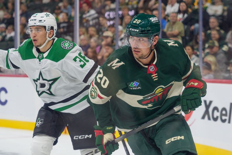 Sep 25, 2025; Saint Paul, Minnesota, USA; Minnesota Wild forward Brett Leason (20) and Dallas Stars defenseman Christian Kyrou (38) look for the puck down ice in the third period at Grand Casino Arena. Mandatory Credit: Matt Blewett-Imagn Images