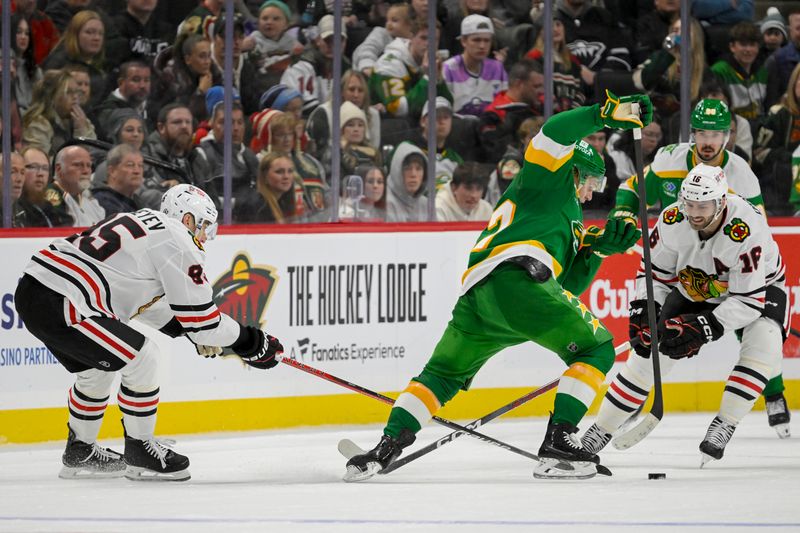 Nov 29, 2024; Saint Paul, Minnesota, USA;  Minnesota Wild forward Kirill Kaprizov (97) mohawks through the stick-check attempts of Chicago Blackhawks forward Ilya Mikheyev (95) and forward Jason Dickinson (16) during the third period at Xcel Energy Center. Mandatory Credit: Nick Wosika-Imagn Images