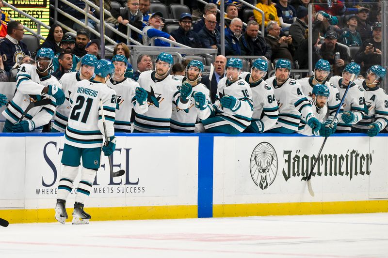 Nov 21, 2024; St. Louis, Missouri, USA;  San Jose Sharks center Alexander Wennberg (21) is congratulated by teammates after scoring against the St. Louis Blues during the first period at Enterprise Center. Mandatory Credit: Jeff Curry-Imagn Images