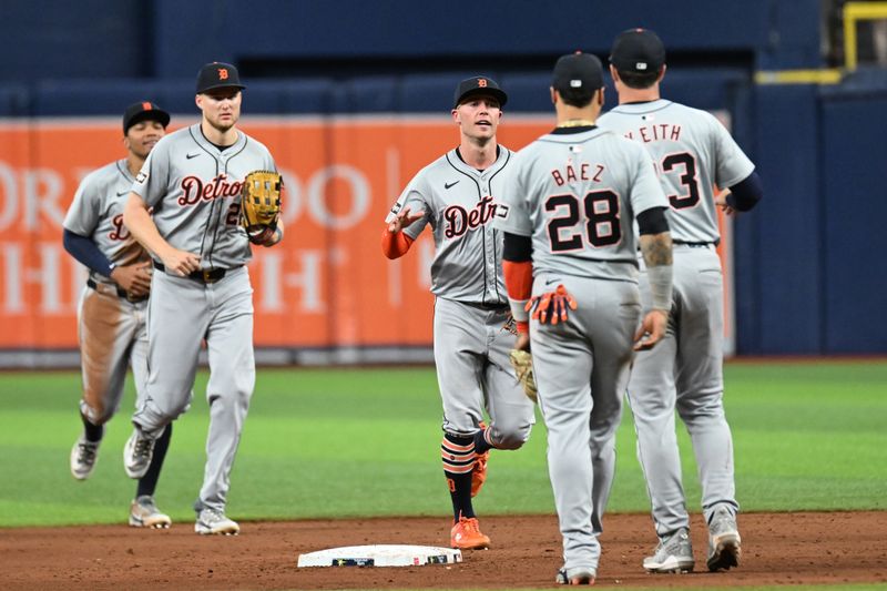 Apr 23, 2024; St. Petersburg, Florida, USA; Members of the Detroit Tigers celebrate after the final out against the Tampa Bay Rays at Tropicana Field. Mandatory Credit: Jonathan Dyer-USA TODAY Sports