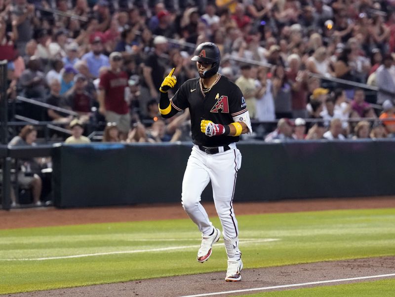 Sep 3, 2023; Phoenix, Arizona, USA; Arizona Diamondbacks left fielder Lourdes Gurriel Jr. (12) runs the bases after hitting a solo home run against the Baltimore Orioles during the first inning at Chase Field. Mandatory Credit: Joe Camporeale-USA TODAY Sports