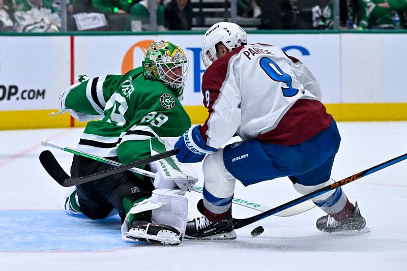 May 9, 2024; Dallas, Texas, USA; Dallas Stars goaltender Jake Oettinger (29) stops a breakaway shot by Colorado Avalanche left wing Zach Parise (9) during the first period in game two of the second round of the 2024 Stanley Cup Playoffs at American Airlines Center. Mandatory Credit: Jerome Miron-USA TODAY Sports