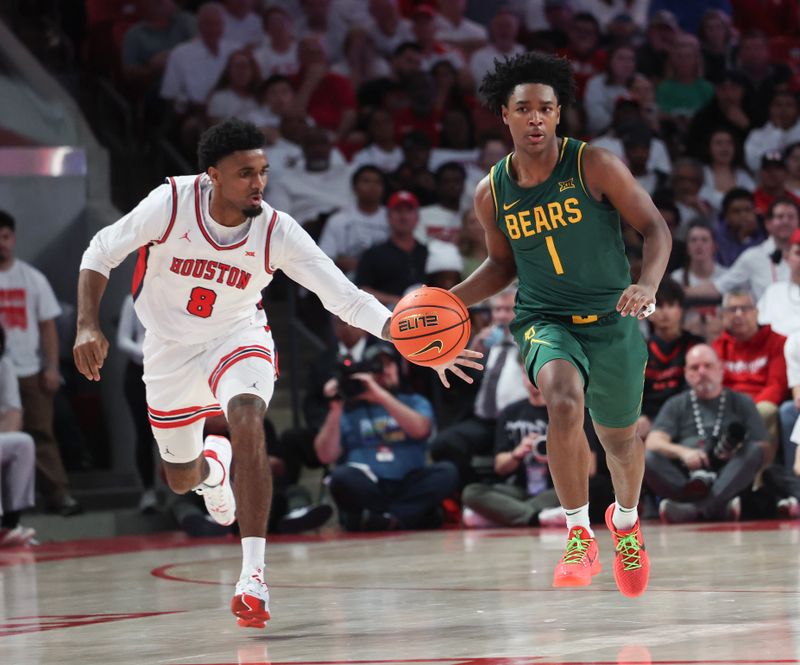 Feb 10, 2025; Houston, Texas, USA; Houston Cougars guard Mylik Wilson (8) steals the ball from Baylor Bears guard Robert Wright III (1) in the second half at Fertitta Center. Mandatory Credit: Thomas Shea-Imagn Images