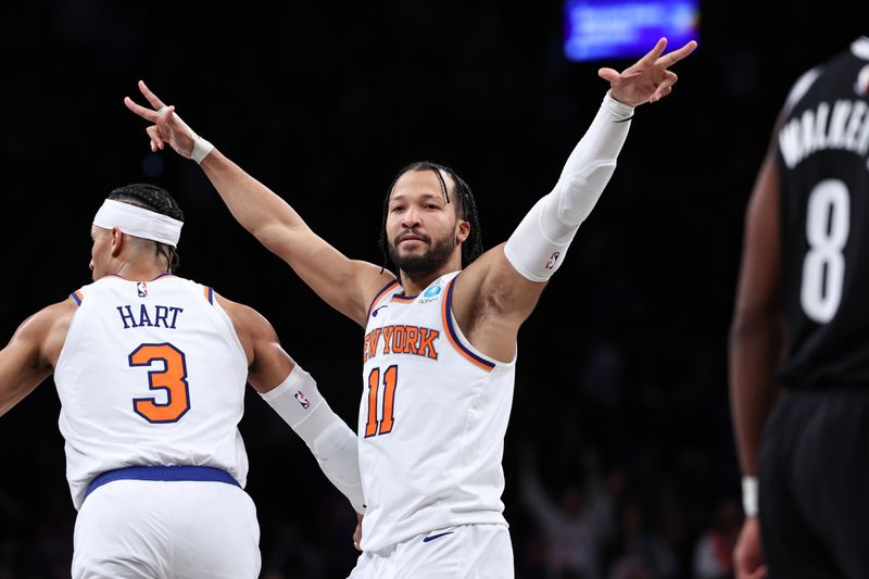 NEW YORK, NEW YORK - JANUARY 23: Jalen Brunson #11 of the New York Knicks reacts after making a three pointer during the fourth quarter of the game against the Brooklyn Nets at Barclays Center on January 23, 2024 in New York City.  NOTE TO USER: User expressly acknowledges and agrees that, by downloading and or using this photograph, User is consenting to the terms and conditions of the Getty Images License Agreement. (Photo by Dustin Satloff/Getty Images)