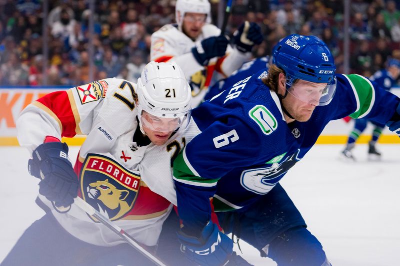 Dec 14, 2023; Vancouver, British Columbia, CAN; Florida Panthers forward Nick Cousins (21) battles with Vancouver Canucks forward Brock Boeser (6) in the second period at Rogers Arena. Mandatory Credit: Bob Frid-USA TODAY Sports