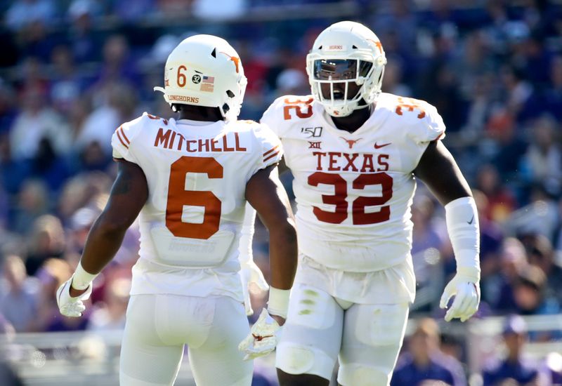 Oct 26, 2019; Fort Worth, TX, USA; Texas Longhorns linebacker Juwan Mitchell (6) and defensive lineman Malcolm Roach (32) react during the first quarter against the TCU Horned Frogs at Amon G. Carter Stadium. Mandatory Credit: Kevin Jairaj-USA TODAY Sports
