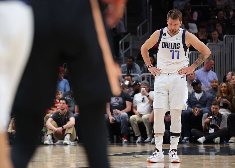 ATLANTA, GEORGIA - APRIL 02:  Luka Doncic #77 of the Dallas Mavericks reacts against the Atlanta Hawks during the first quarter at State Farm Arena on April 02, 2023 in Atlanta, Georgia.  NOTE TO USER: User expressly acknowledges and agrees that, by downloading and or using this photograph, User is consenting to the terms and conditions of the Getty Images License Agreement.  (Photo by Kevin C. Cox/Getty Images)