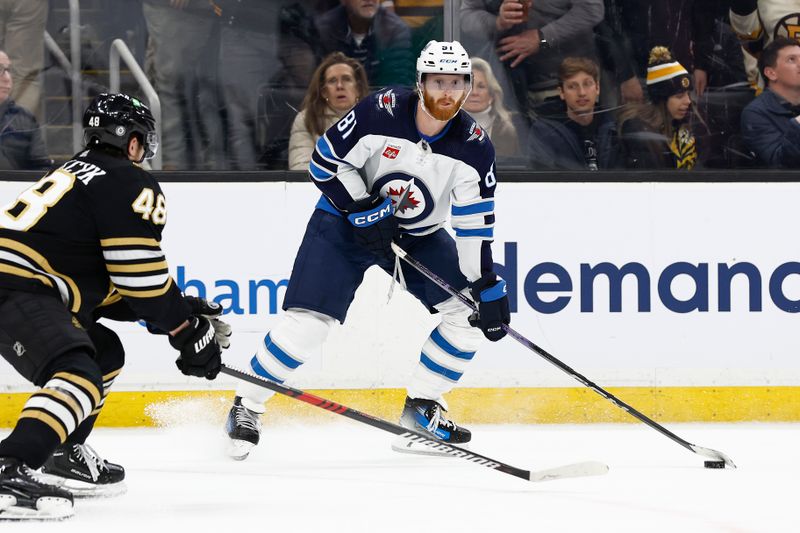 Jan 22, 2024; Boston, Massachusetts, USA; Winnipeg Jets left wing Kyle Connor (81) looks for an opening against the Boston Bruins during the first period at TD Garden. Mandatory Credit: Winslow Townson-USA TODAY Sports