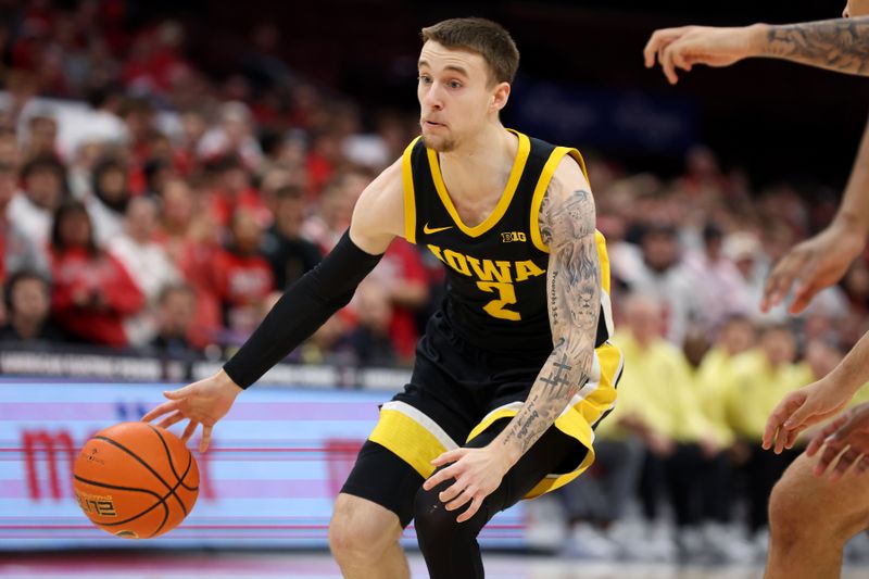 Jan 27, 2025; Columbus, Ohio, USA;  Iowa Hawkeyes guard Brock Harding (2) dribbles the ball during the first half against the Ohio State Buckeyes at Value City Arena. Mandatory Credit: Joseph Maiorana-Imagn Images