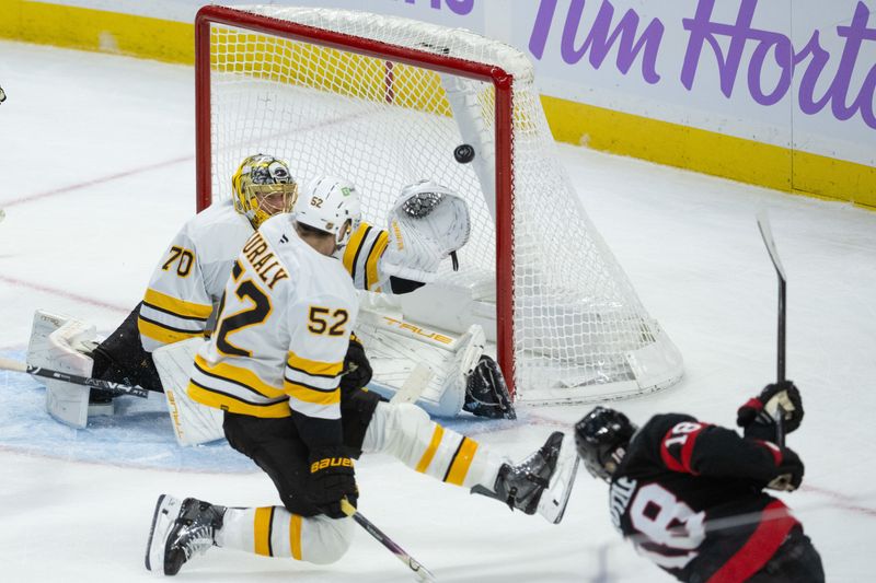 Nov 13, 2025; Ottawa, Ontario, CAN; Ottawa Senators center Tim Stutzle (18) scores against Boston Bruins goalie Joonas Korpisalo (70) in the third period at the Canadian Tire Centre. Mandatory Credit: Marc DesRosiers-IMAGN Images