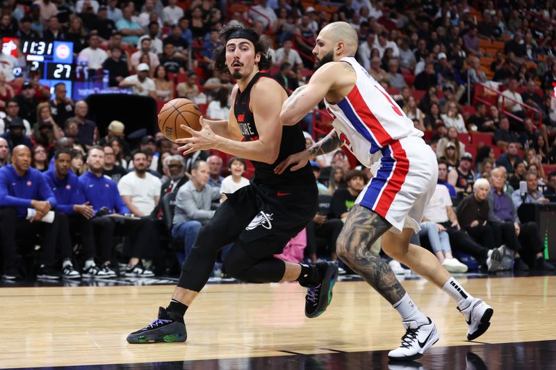 MIAMI, FLORIDA - MARCH 05: Jaime Jaquez Jr. #11 of the Miami Heat drives against Evan Fournier #31 of the Detroit Pistons during the second quarter of the game at Kaseya Center on March 05, 2024 in Miami, Florida. NOTE TO USER: User expressly acknowledges and agrees that, by downloading and or using this photograph, User is consenting to the terms and conditions of the Getty Images License Agreement. (Photo by Megan Briggs/Getty Images)