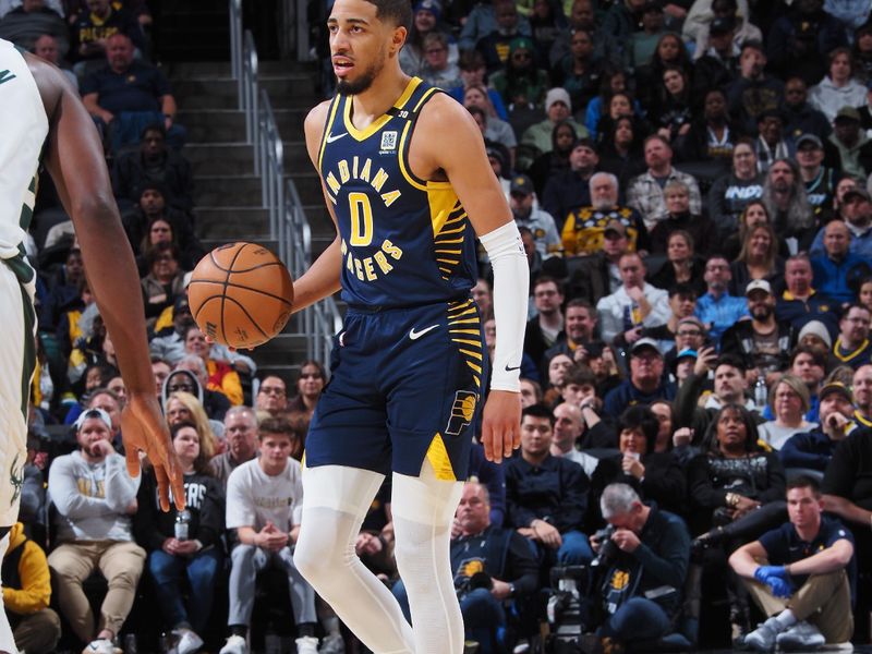 INDIANAPOLIS, IN - JANUARY 3: Tyrese Haliburton #0 of the Indiana Pacers handles the ball during the game against the Milwaukee Bucks on January 3, 2024 at Gainbridge Fieldhouse in Indianapolis, Indiana. NOTE TO USER: User expressly acknowledges and agrees that, by downloading and or using this Photograph, user is consenting to the terms and conditions of the Getty Images License Agreement. Mandatory Copyright Notice: Copyright 2024 NBAE (Photo by Ron Hoskins/NBAE via Getty Images)