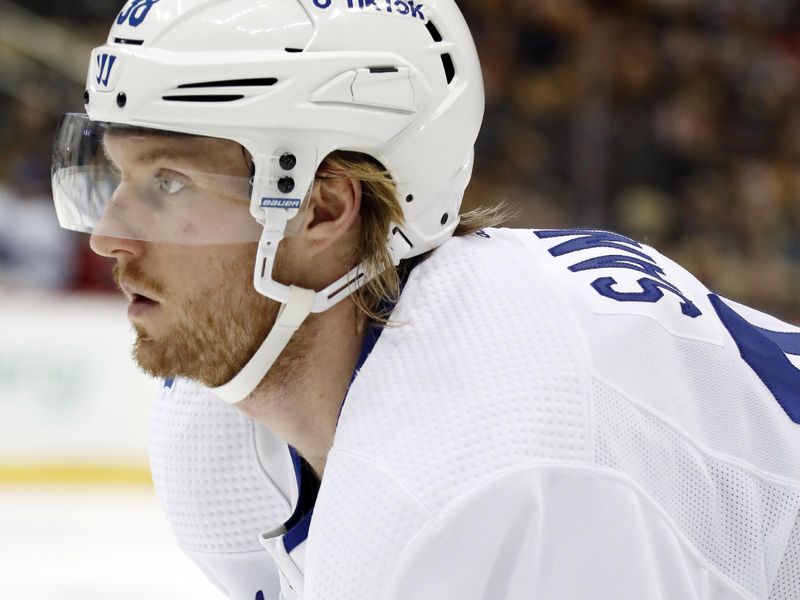 Nov 26, 2022; Pittsburgh, Pennsylvania, USA;  Toronto Maple Leafs defenseman Rasmus Sandin (38) looks on at the face-off circle against the Pittsburgh Penguins during the third period at PPG Paints Arena. Toronto won 4-1. Mandatory Credit: Charles LeClaire-USA TODAY Sports