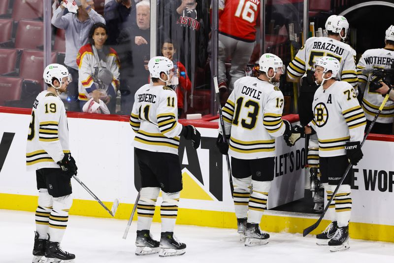 May 14, 2024; Sunrise, Florida, USA; Boston Bruins players celebrate with defenseman Charlie McAvoy (73) after winning against the Florida Panthers in game five of the second round of the 2024 Stanley Cup Playoffs at Amerant Bank Arena. Mandatory Credit: Sam Navarro-USA TODAY Sports