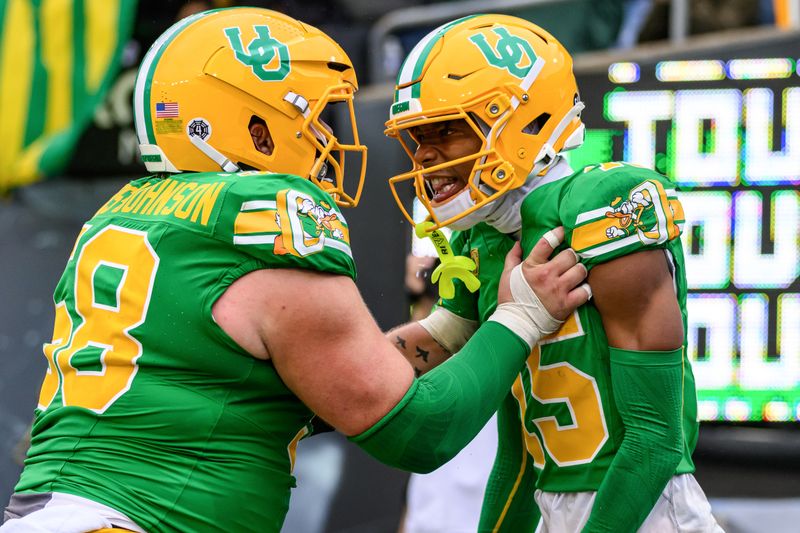 Oct 21, 2023; Eugene, Oregon, USA; Oregon Ducks offensive lineman Jackson Powers-Johnson (58) celebrates a touchdown by wide receiver Tez Johnson (15) during the fourth quarter against the Washington State Cougars at Autzen Stadium. Mandatory Credit: Craig Strobeck-USA TODAY Sports