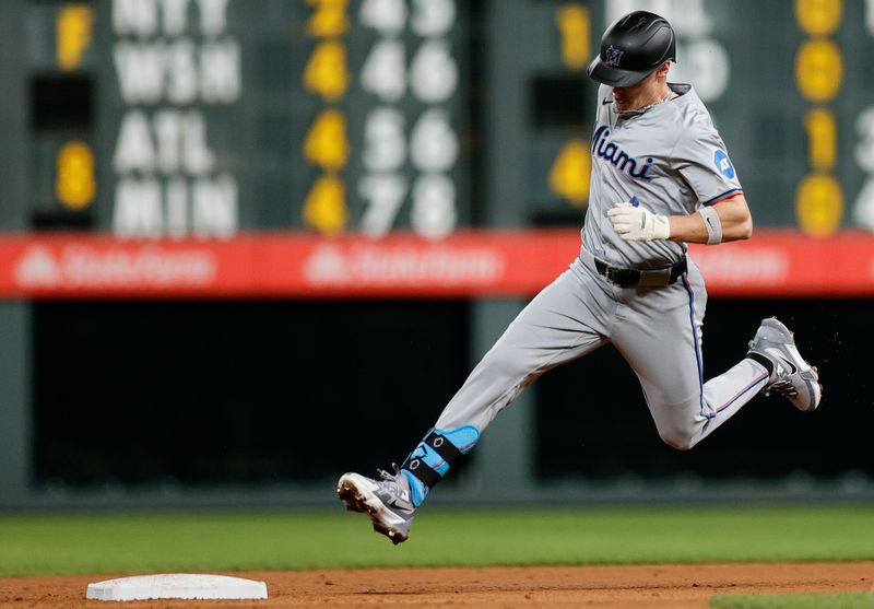 Aug 27, 2024; Denver, Colorado, USA; Miami Marlins right fielder Griffin Conine (56) rounds second on a triple in the sixth inning against the Colorado Rockies at Coors Field. Mandatory Credit: Isaiah J. Downing-USA TODAY Sports