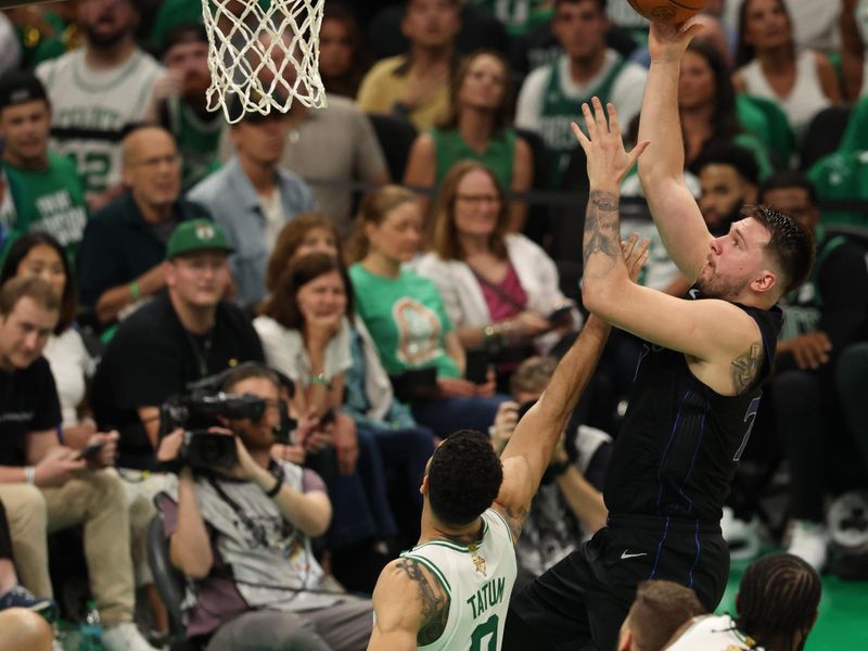 BOSTON, MA - JUNE 6: Luka Doncic #77 of the Dallas Mavericks shoots the ball during the game against the Boston Celtics during Game One of the 2024 NBA Finals on June 6, 2024 at the TD Garden in Boston, Massachusetts. NOTE TO USER: User expressly acknowledges and agrees that, by downloading and or using this photograph, User is consenting to the terms and conditions of the Getty Images License Agreement. Mandatory Copyright Notice: Copyright 2024 NBAE  (Photo by Lauren Leigh Bacho/NBAE via Getty Images)